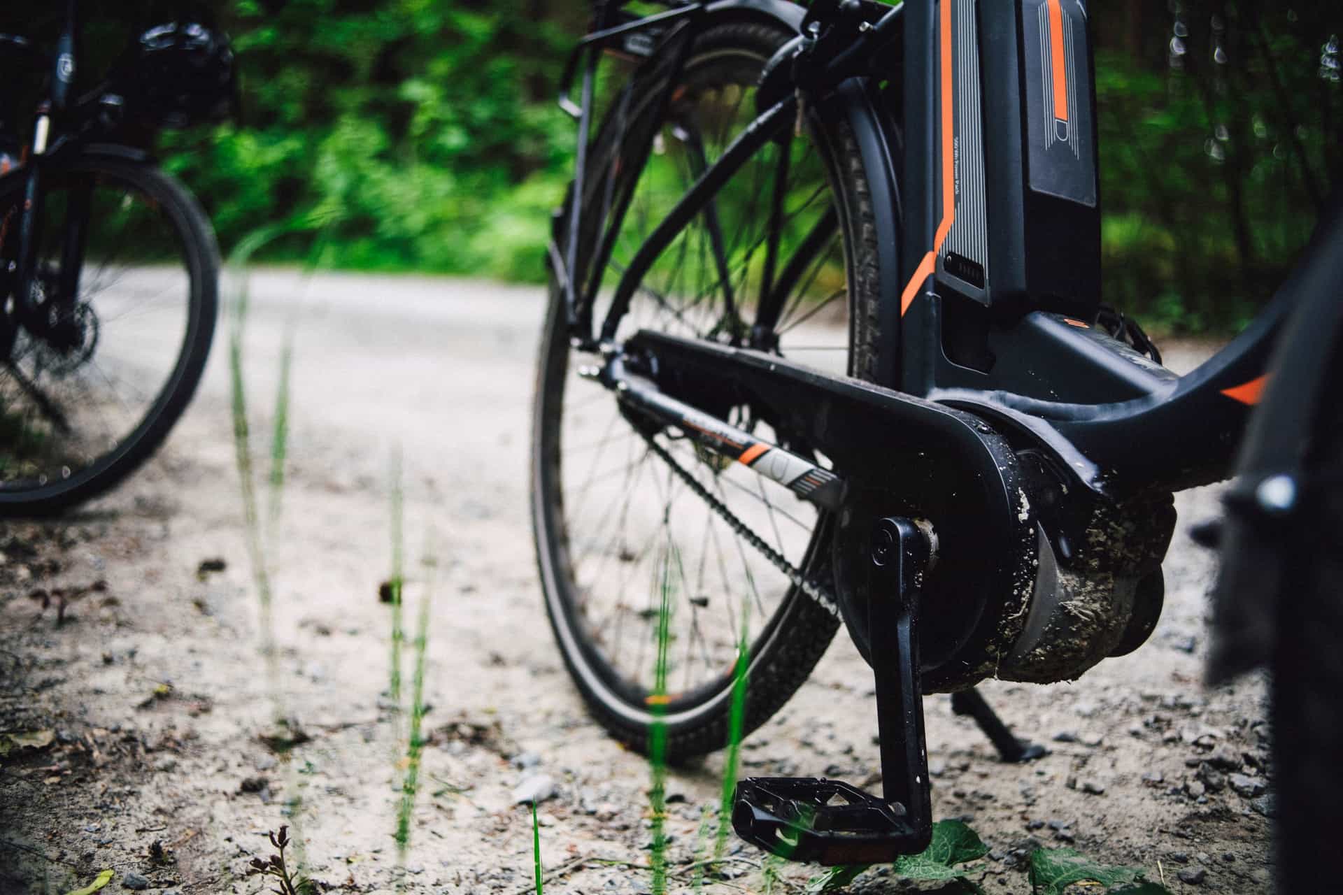 A mountain bike on a gravel path through forest