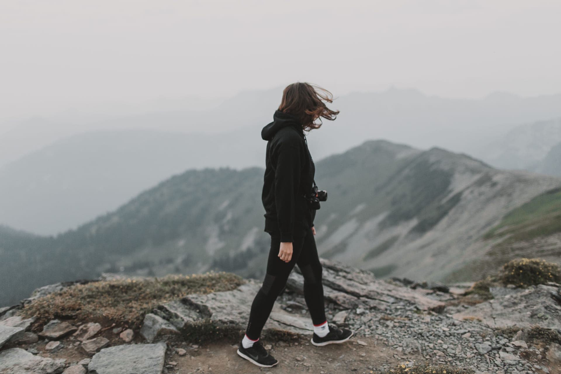 A hiker on a rocky mountain path
