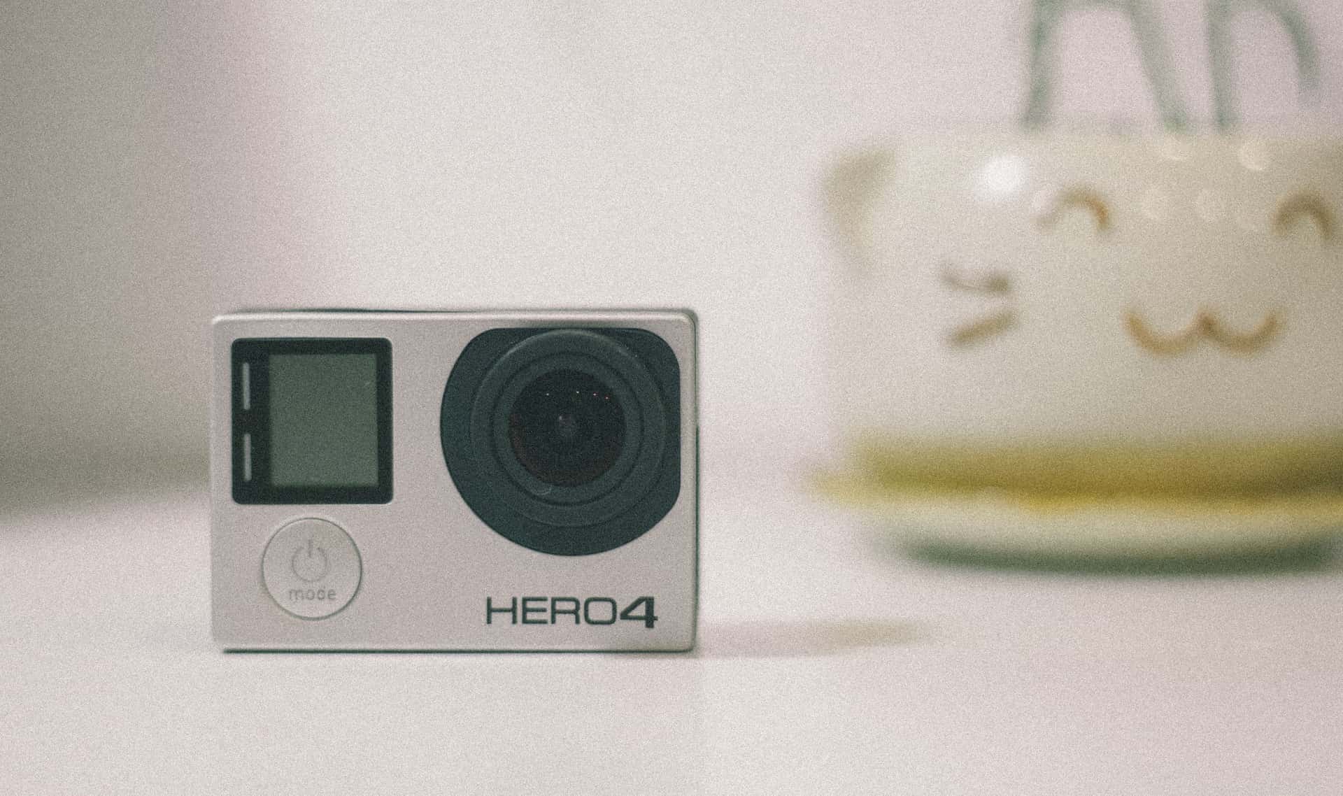 A compact action camera on a desk